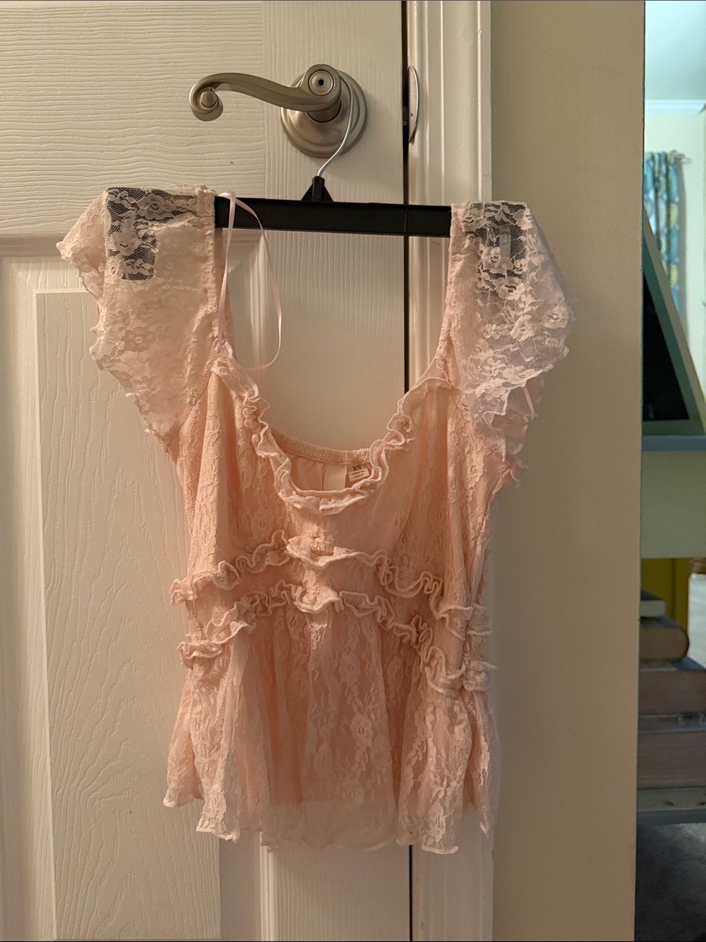Women’s light pink ruffled blouse